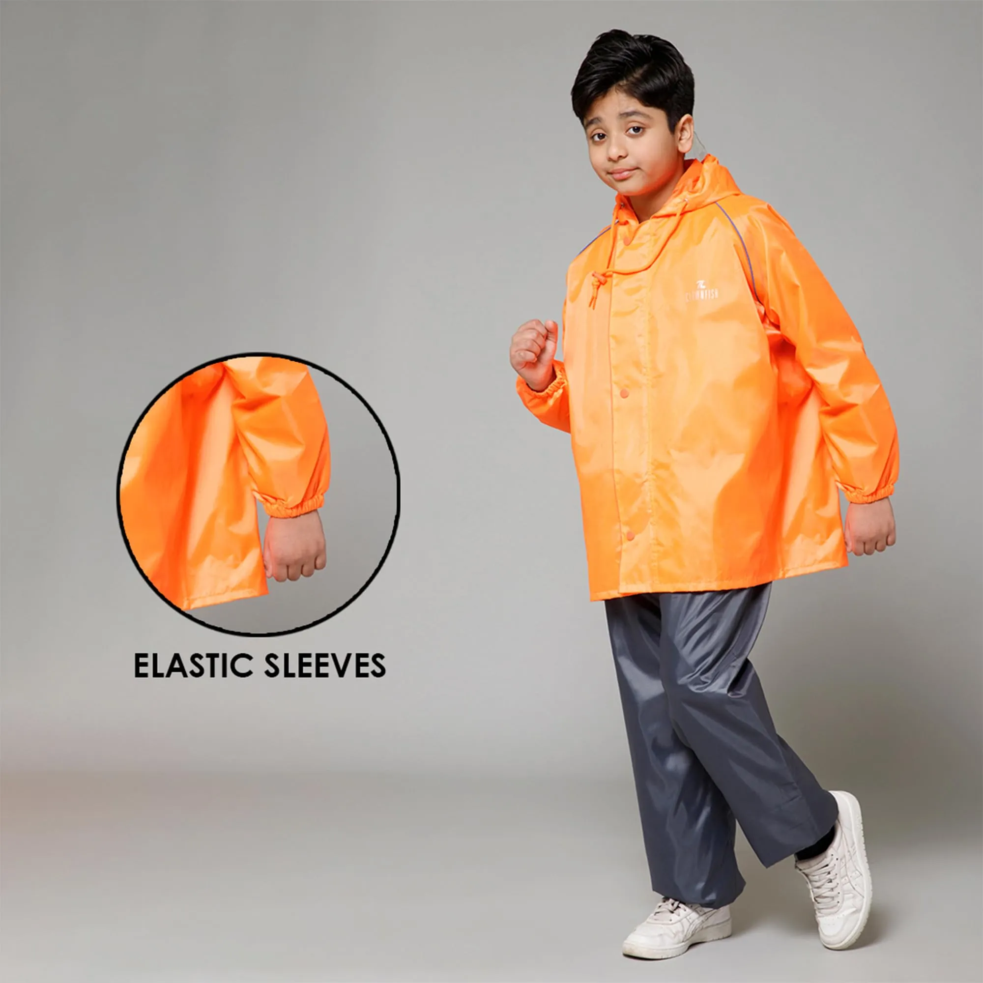 THE CLOWNFISH Duke Series Kids Waterproof Polyester Double Coating Reversible Raincoat with Hood and Reflector Logo at Back. Set of Top and Bottom. Printed Plastic Pouch. Kid Age-5-7 years (Orange)