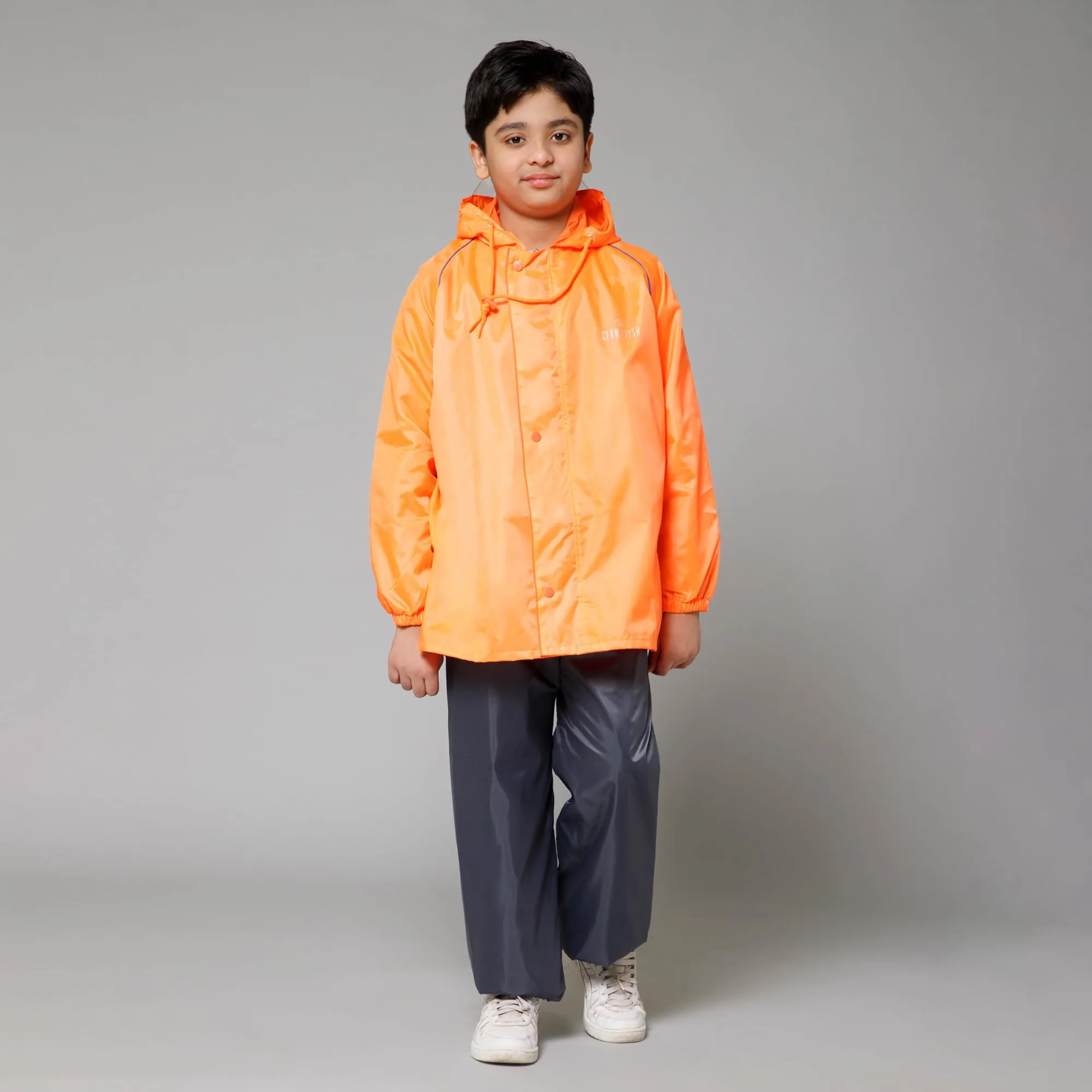 THE CLOWNFISH Duke Series Kids Waterproof Polyester Double Coating Reversible Raincoat with Hood and Reflector Logo at Back. Set of Top and Bottom. Printed Plastic Pouch. Kid Age-5-7 years (Orange)